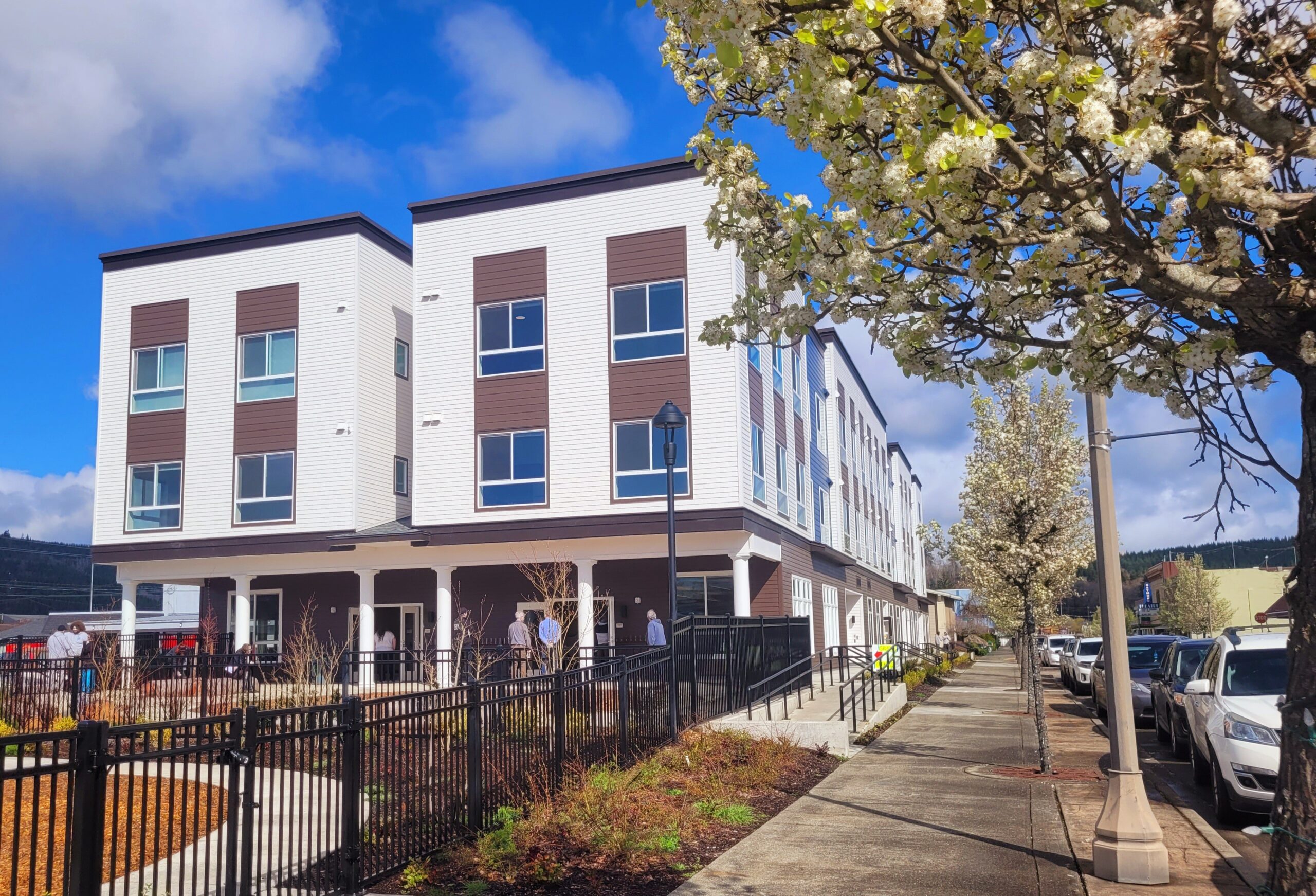 Behavioral Health facility building and with park and trees visible.